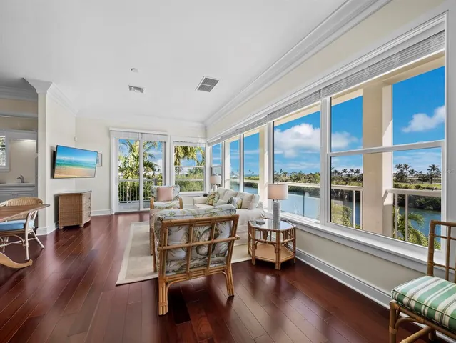 a view of a dining room with a table and chairs