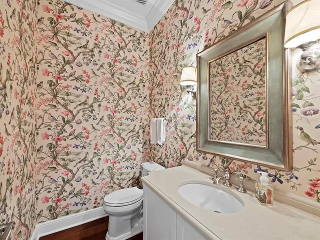 a kitchen with wooden cabinets and white appliances