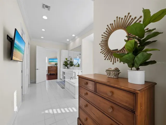 a view of a house with swimming pool and sitting area