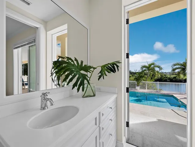a view of swimming pool with outdoor seating and plants