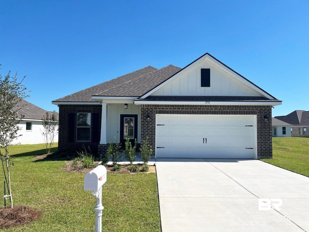 1733 Breckinridge Place Foley, AL 36535 - Photo 1 of 18 View of front of property with a garage and a front lawn