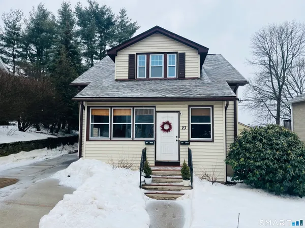 a front view of a house with a yard
