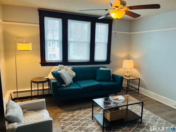 a living room with furniture and a window