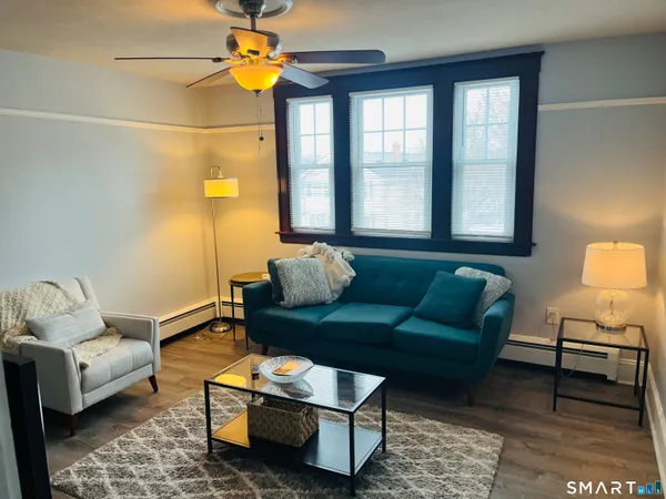 a living room with furniture and a window
