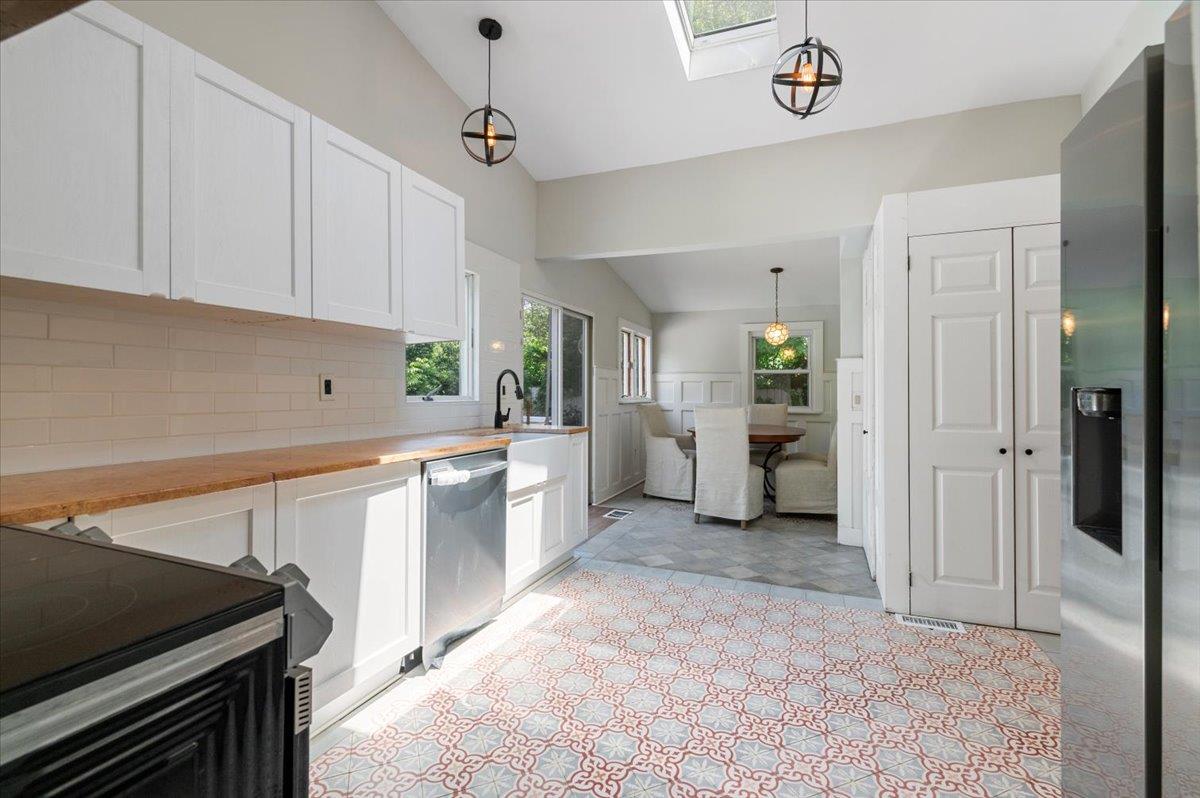 56 West Donellan Road Hampton Bays, NY 11946 - Photo 14 of 27 a kitchen with a refrigerator and a sink