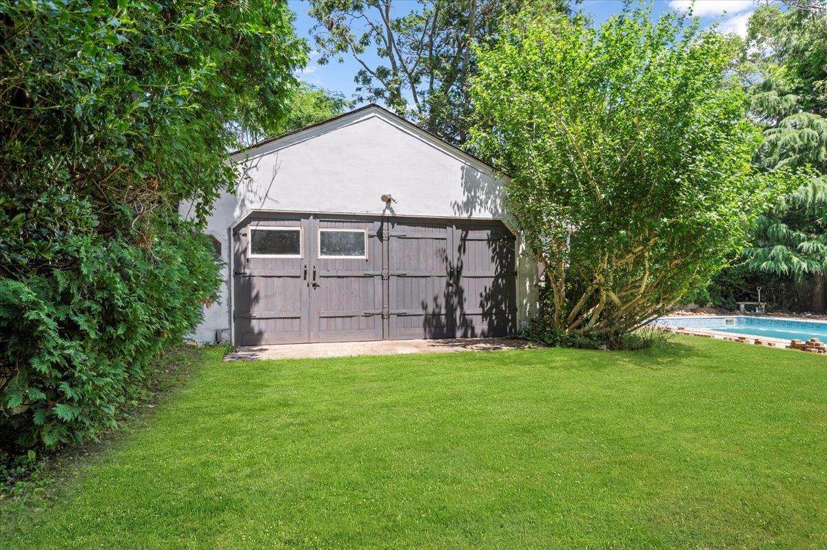 56 West Donellan Road Hampton Bays, NY 11946 - Photo 23 of 27 a view of a backyard of the house