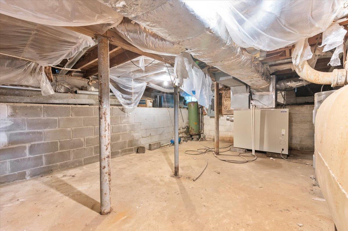 56 West Donellan Road Hampton Bays, NY 11946 - Photo 25 of 27 a view of a street with wooden fence