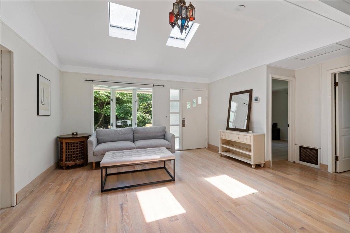 56 West Donellan Road Hampton Bays, NY 11946 - Photo 5 of 27 a living room with furniture and a large window