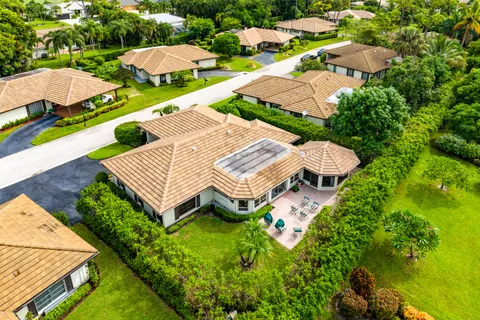 an aerial view of a house with swimming pool and outdoor space