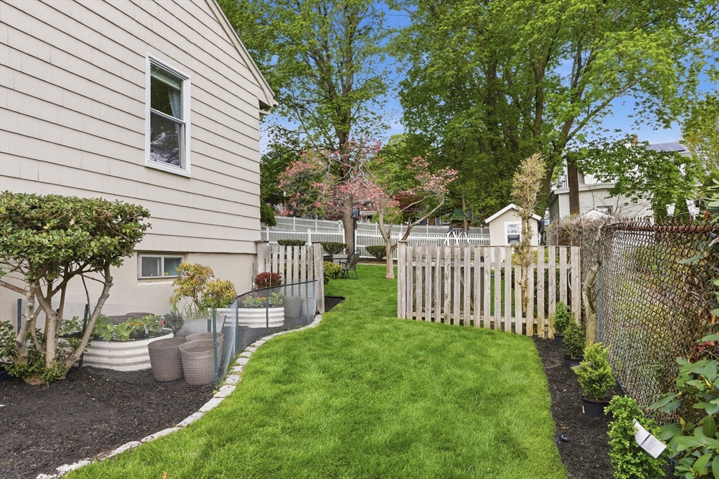 115 Collincote Street Stoneham, MA 02180 - Photo 24 of 25 a view of a house with backyard and sitting area