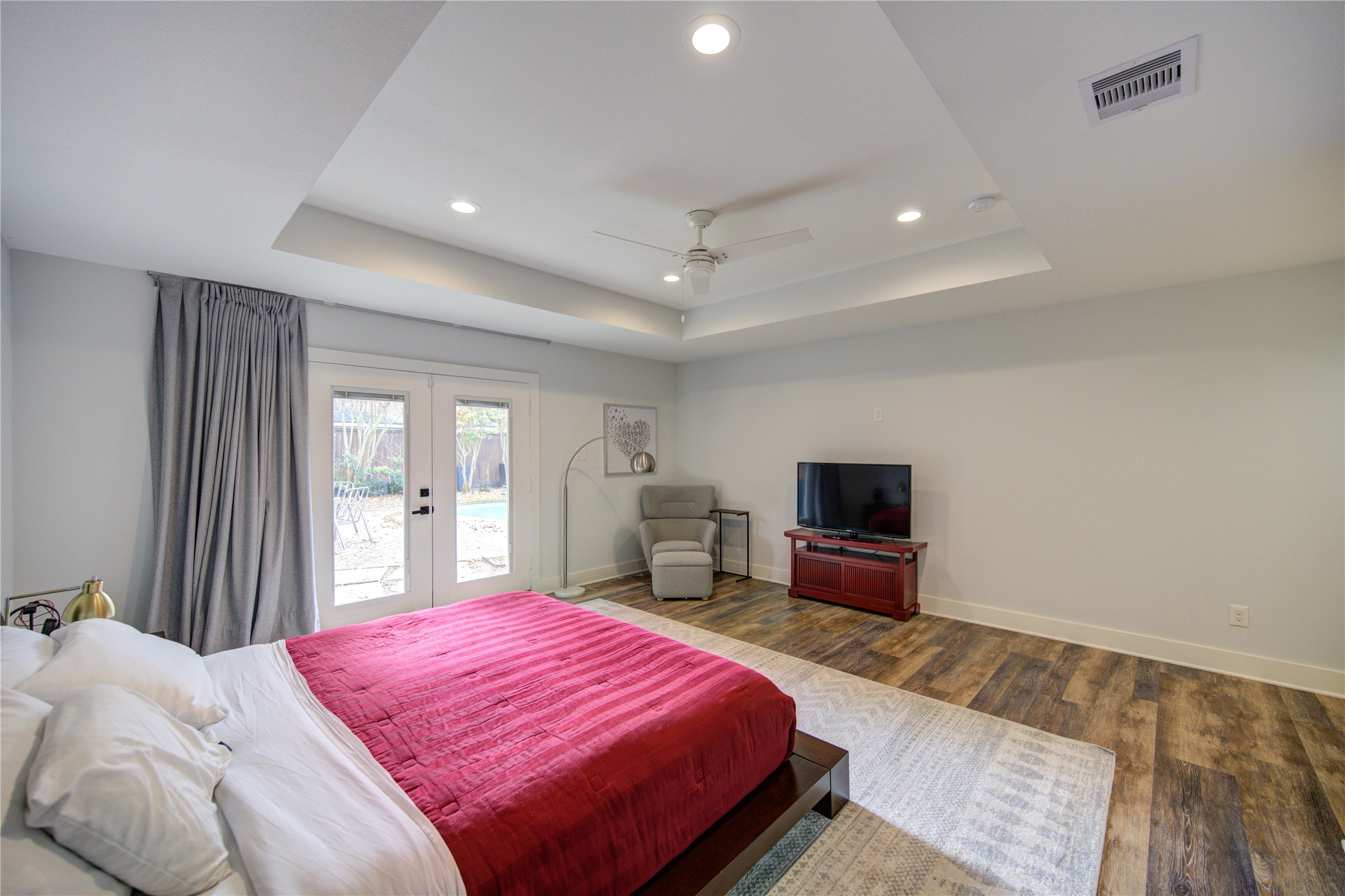 1215 Bethlehem Street Houston, TX 77018 - Photo 15 of 42 a bedroom with a bed and a flat screen tv