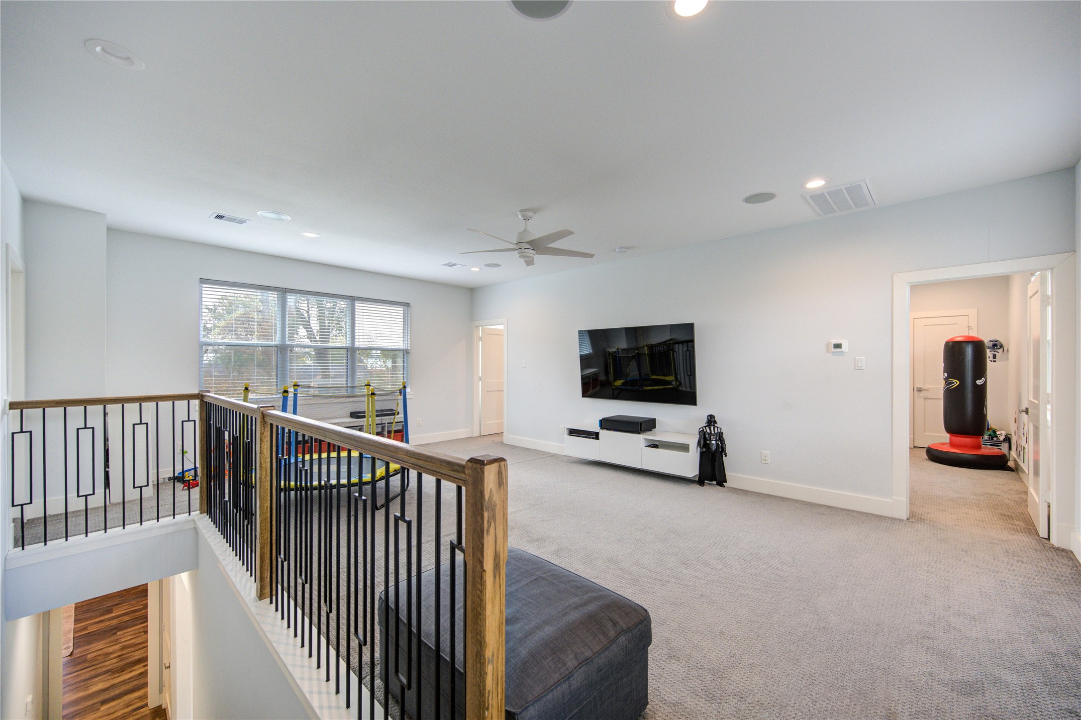 1215 Bethlehem Street Houston, TX 77018 - Photo 21 of 42 a view of a livingroom with furniture and a flat screen tv