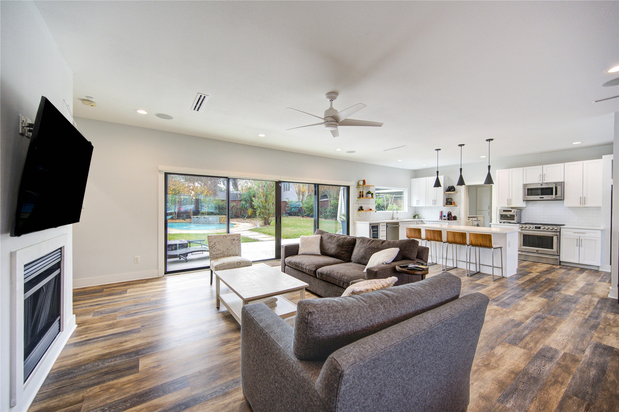1215 Bethlehem Street Houston, TX 77018 - Photo 4 of 42 a living room with fireplace furniture and a flat screen tv