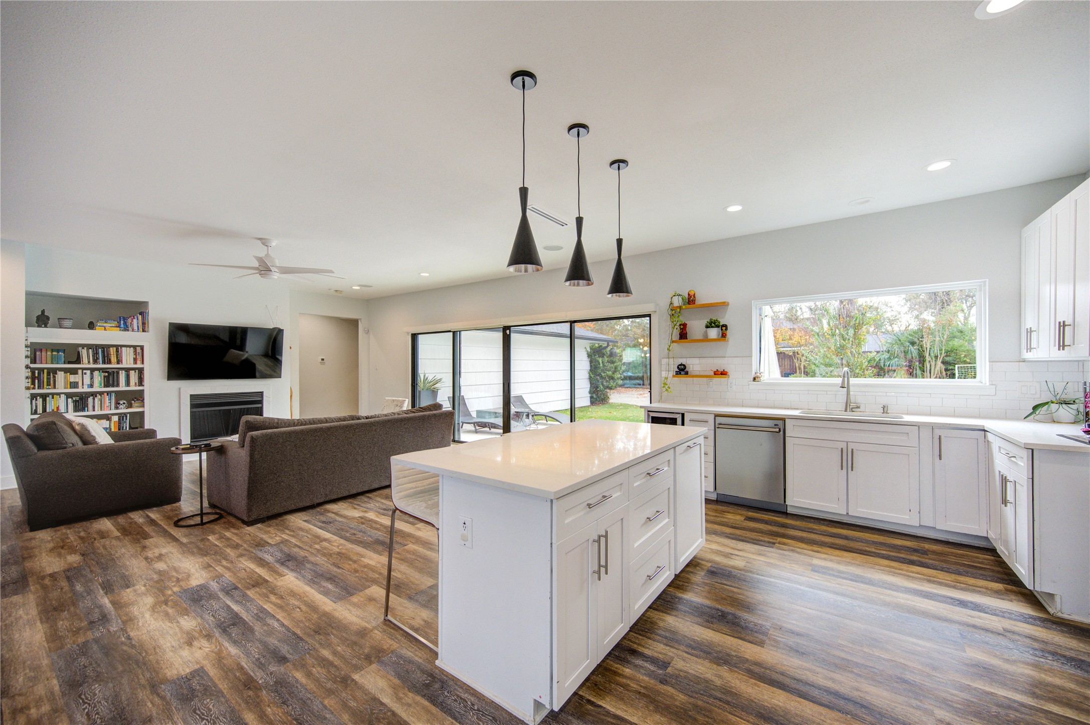 1215 Bethlehem Street Houston, TX 77018 - Photo 8 of 42 a large white kitchen with a stove a sink a window and dining table