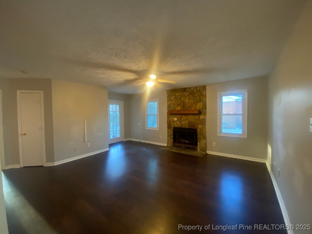 110 Bruce Lane Spring Lake, NC 28390 - Photo 2 of 11 a view of a livingroom with wooden floor a fireplace and window