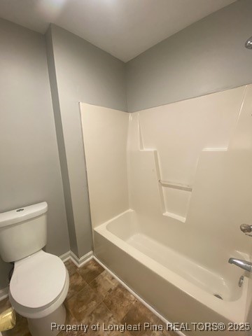 110 Bruce Lane Spring Lake, NC 28390 - Photo 8 of 11 a white toilet sitting next to a bath tub and a shower