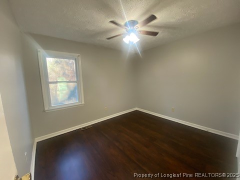 110 Bruce Lane Spring Lake, NC 28390 - Photo 9 of 11 an empty room with wooden floor and windows