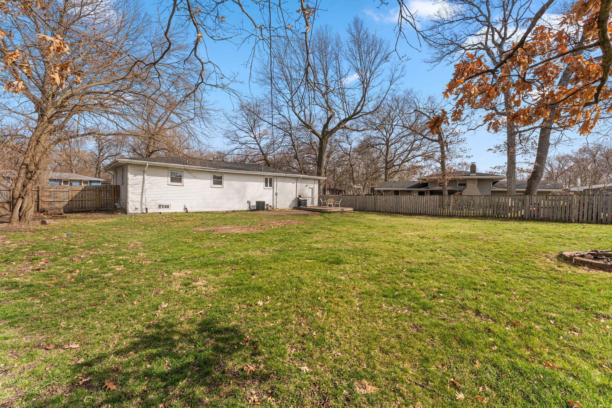 2334 Venus Street Portage, IN 46368 - Photo 19 of 22 a view of a yard with a large tree