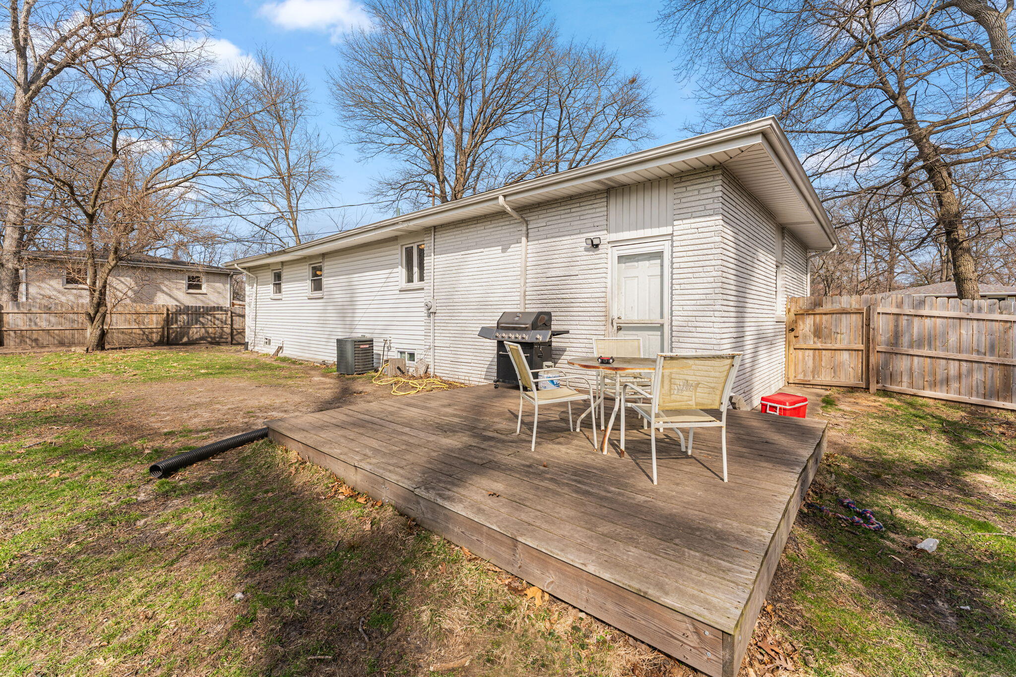 2334 Venus Street Portage, IN 46368 - Photo 21 of 22 a view of a backyard with table and chairs