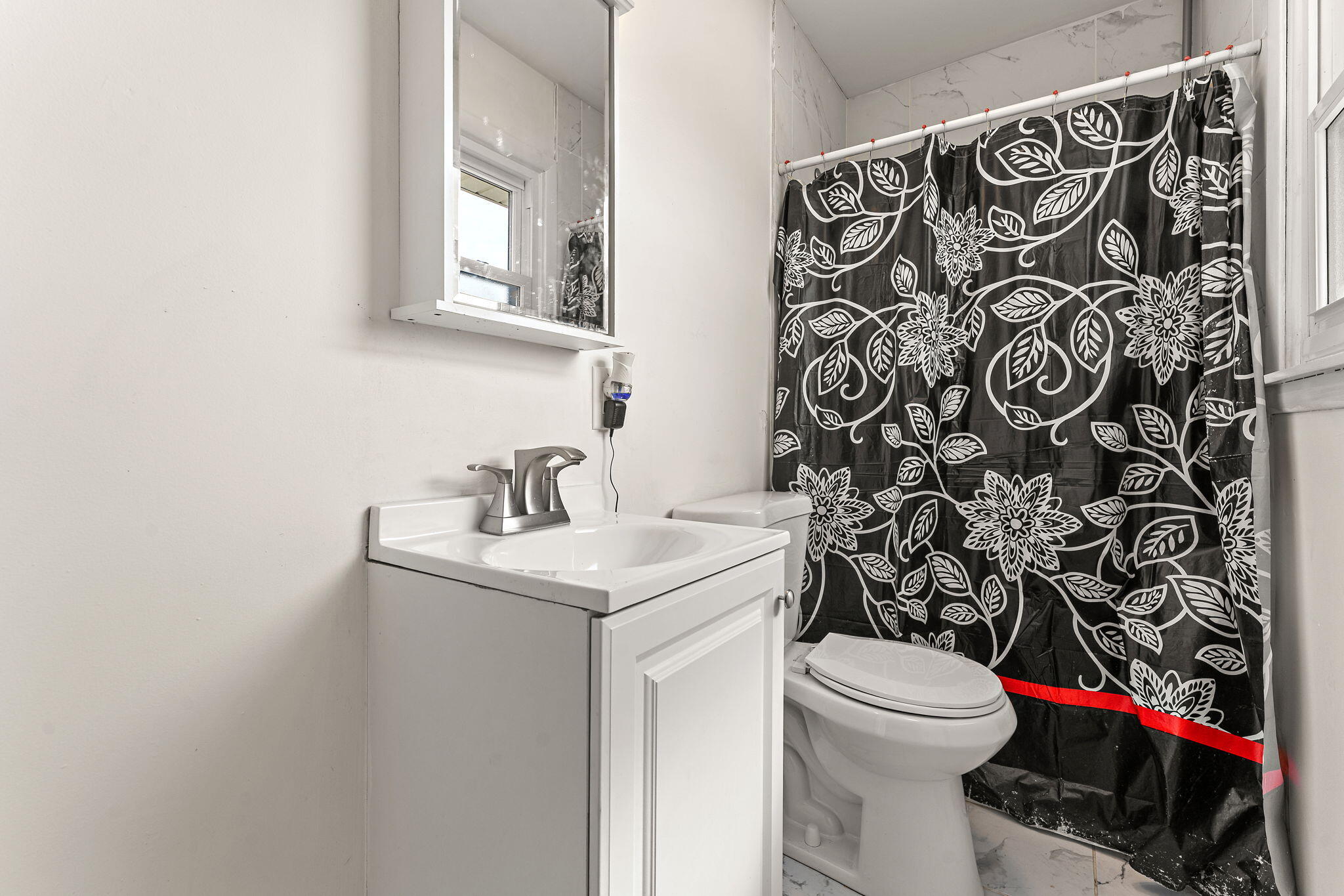 2334 Venus Street Portage, IN 46368 - Photo 10 of 22 a bathroom with a toilet and a sink