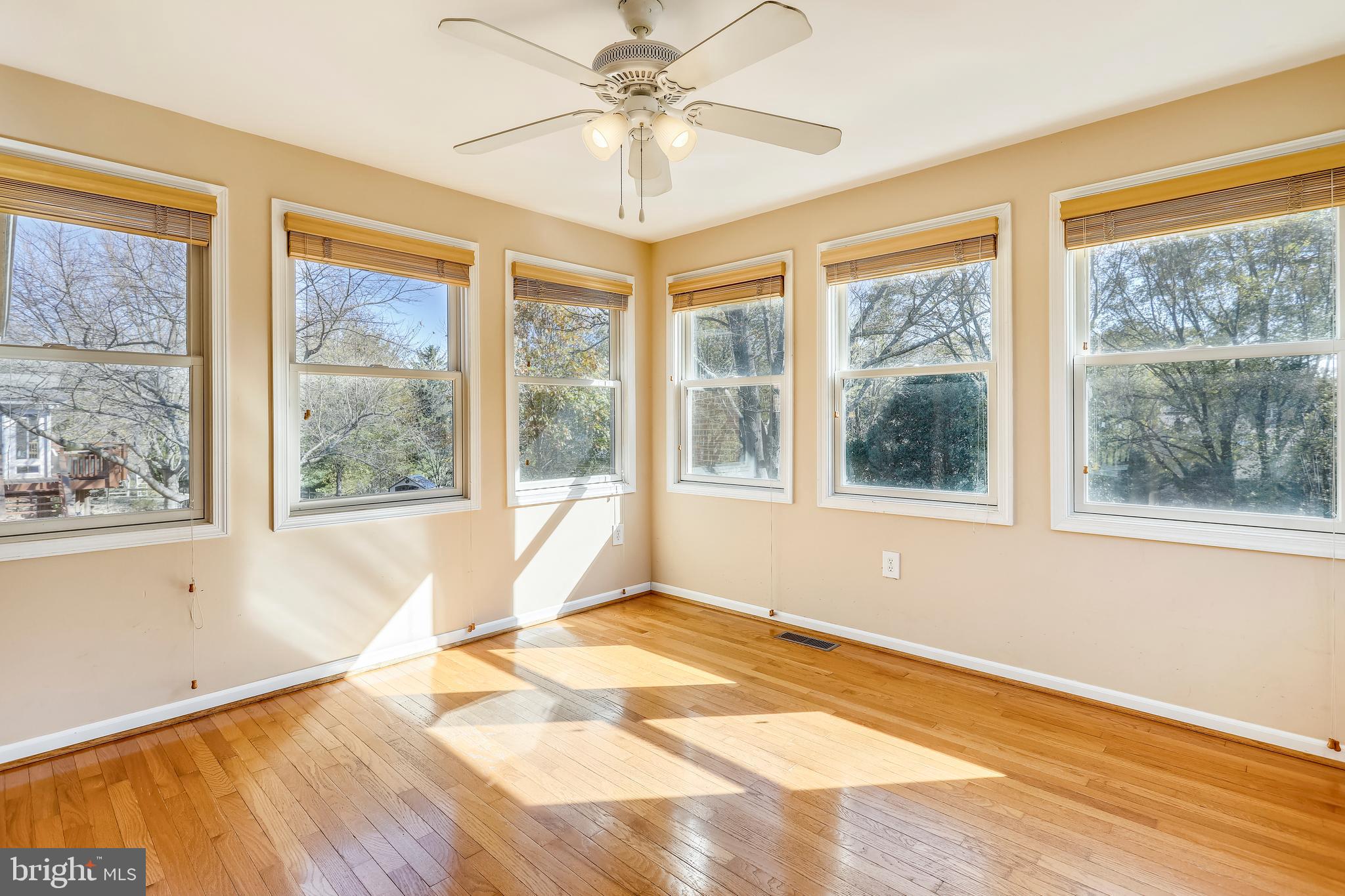 3728 Briars Road Olney, MD 20832 - Photo 18 of 54 a view of an empty room with a window and wooden floor