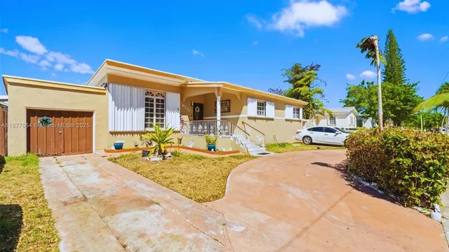 a view of a house with outdoor space and sitting area
