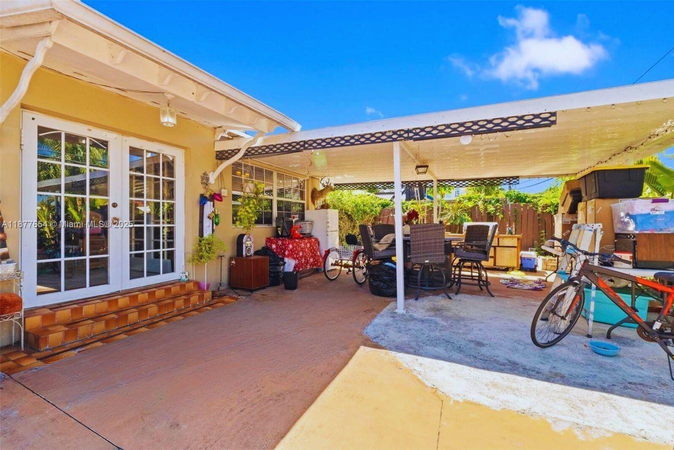8571 Southwest 30th Street Miami, FL 33155 - Photo 13 of 15 a view of a chairs and tables in front of a building