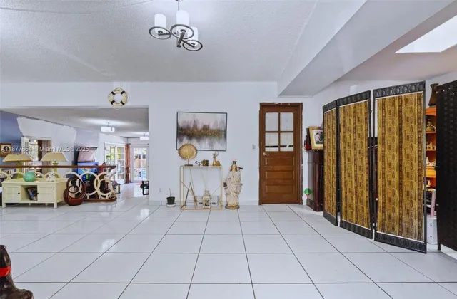 a view of a livingroom with furniture and a window