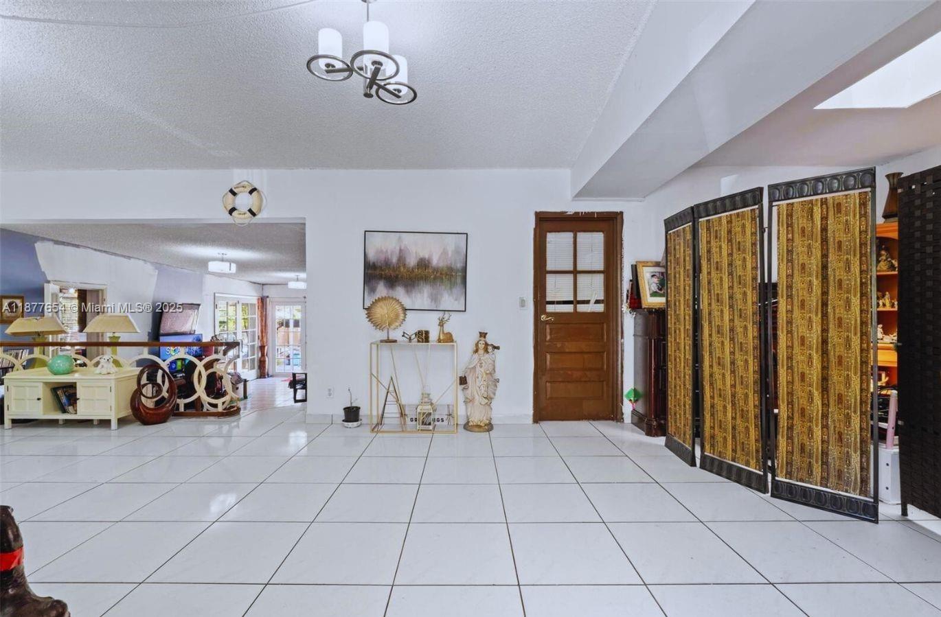 8571 Southwest 30th Street Miami, FL 33155 - Photo 3 of 15 a view of a livingroom with furniture and a window