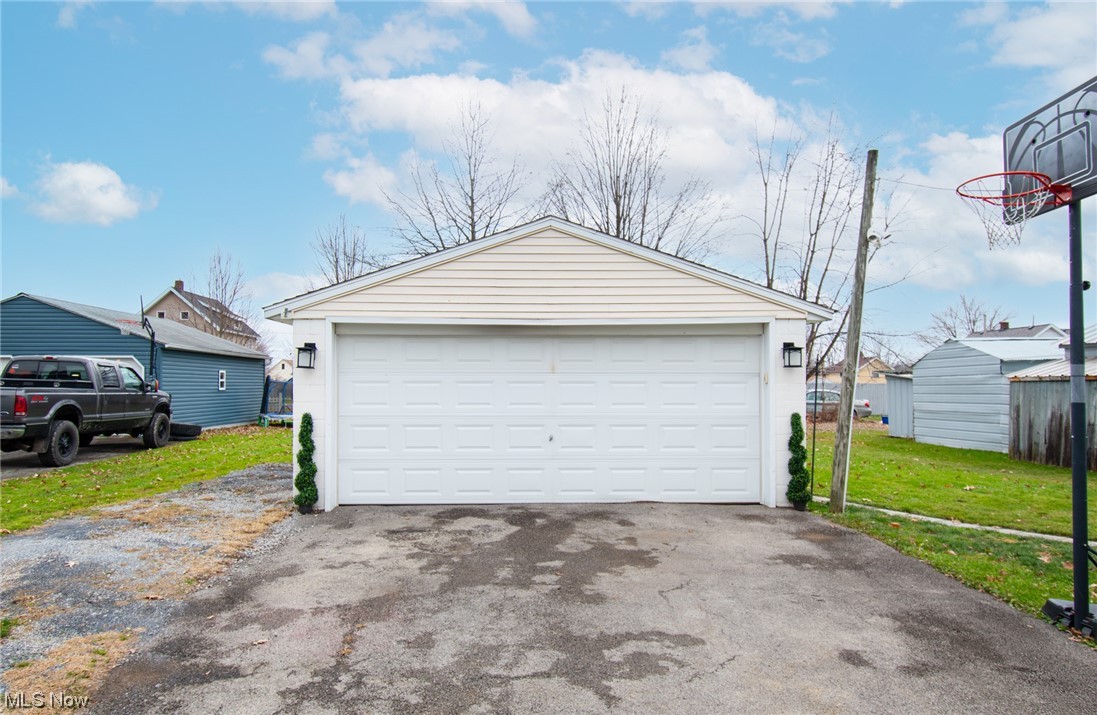 117 Morrison Street Struthers, OH 44471 - Photo 34 of 38 Garage featuring a lawn
