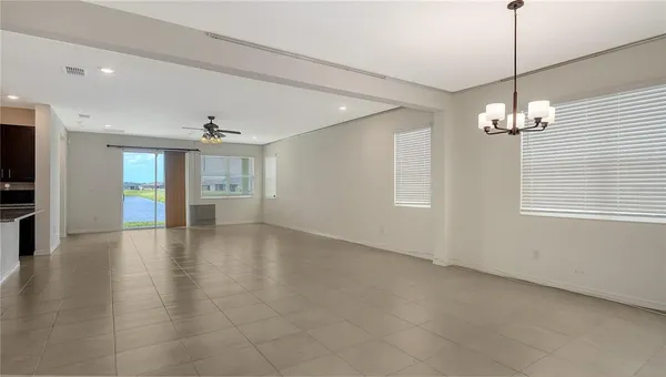 a view of livingroom and kitchen with hardwood floor and kitchen view