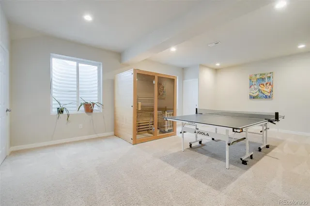 a bedroom with bed and a chandelier