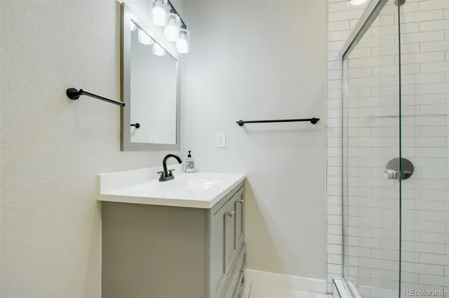 a bathroom with a toilet sink and shower