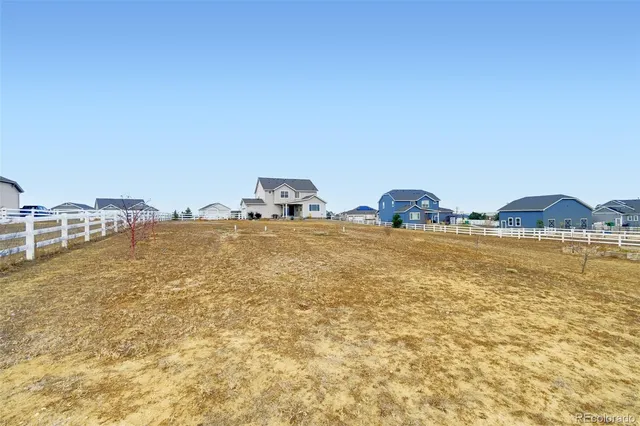 a house with a swimming pool in front of it