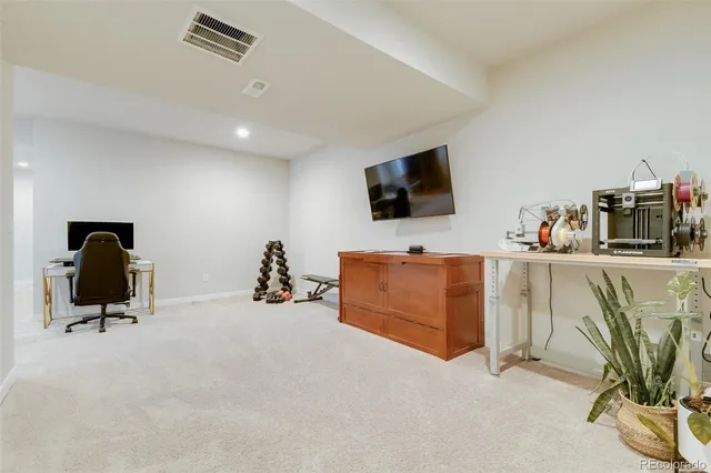 a room with furniture and a flat screen tv
