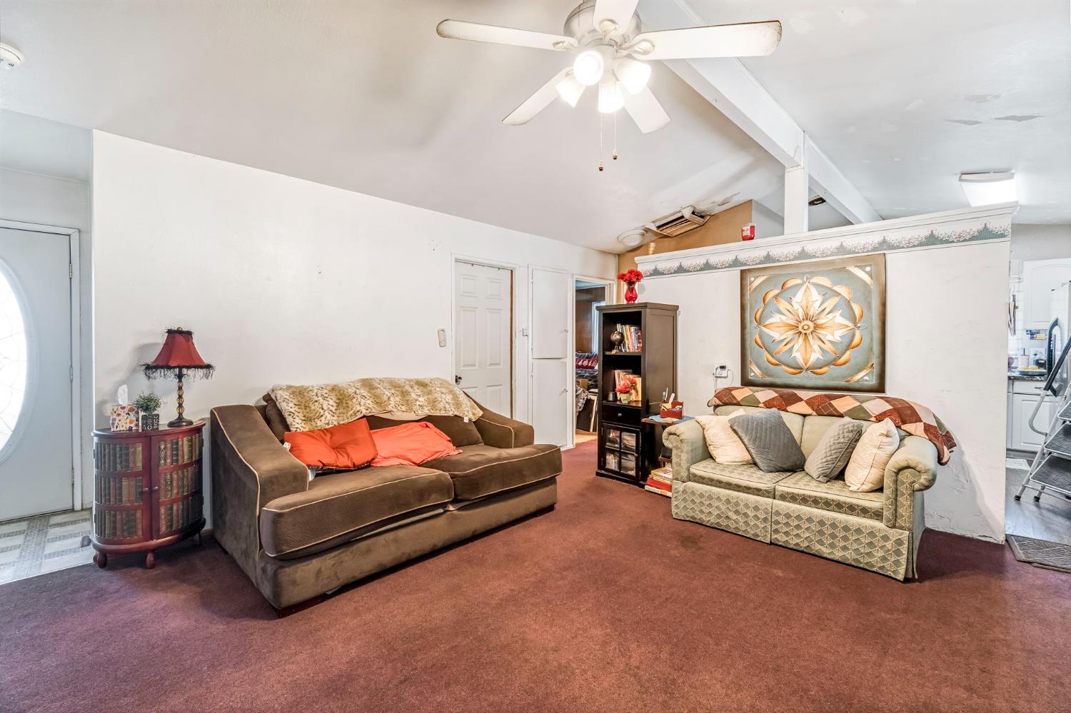 1205 Rogers Street Madera, CA 93638 - Photo 12 of 23 a living room with furniture and a chandelier