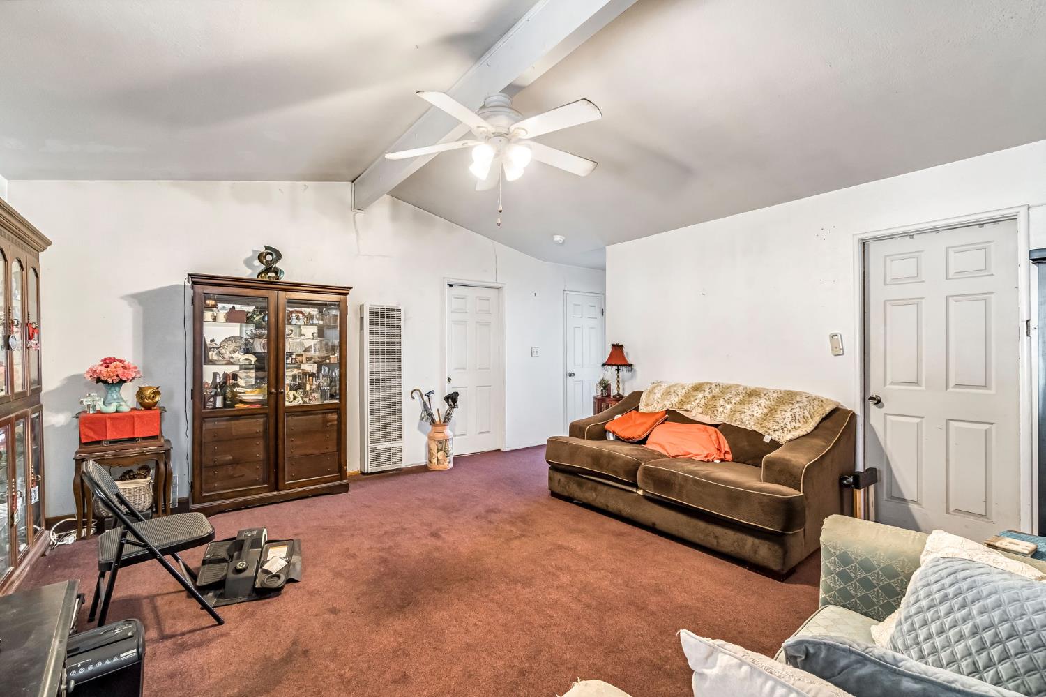 1205 Rogers Street Madera, CA 93638 - Photo 13 of 23 a living room with furniture a air conditioner and a window