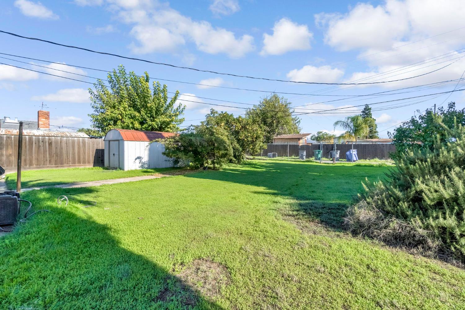 1205 Rogers Street Madera, CA 93638 - Photo 22 of 23 a house view with a garden space