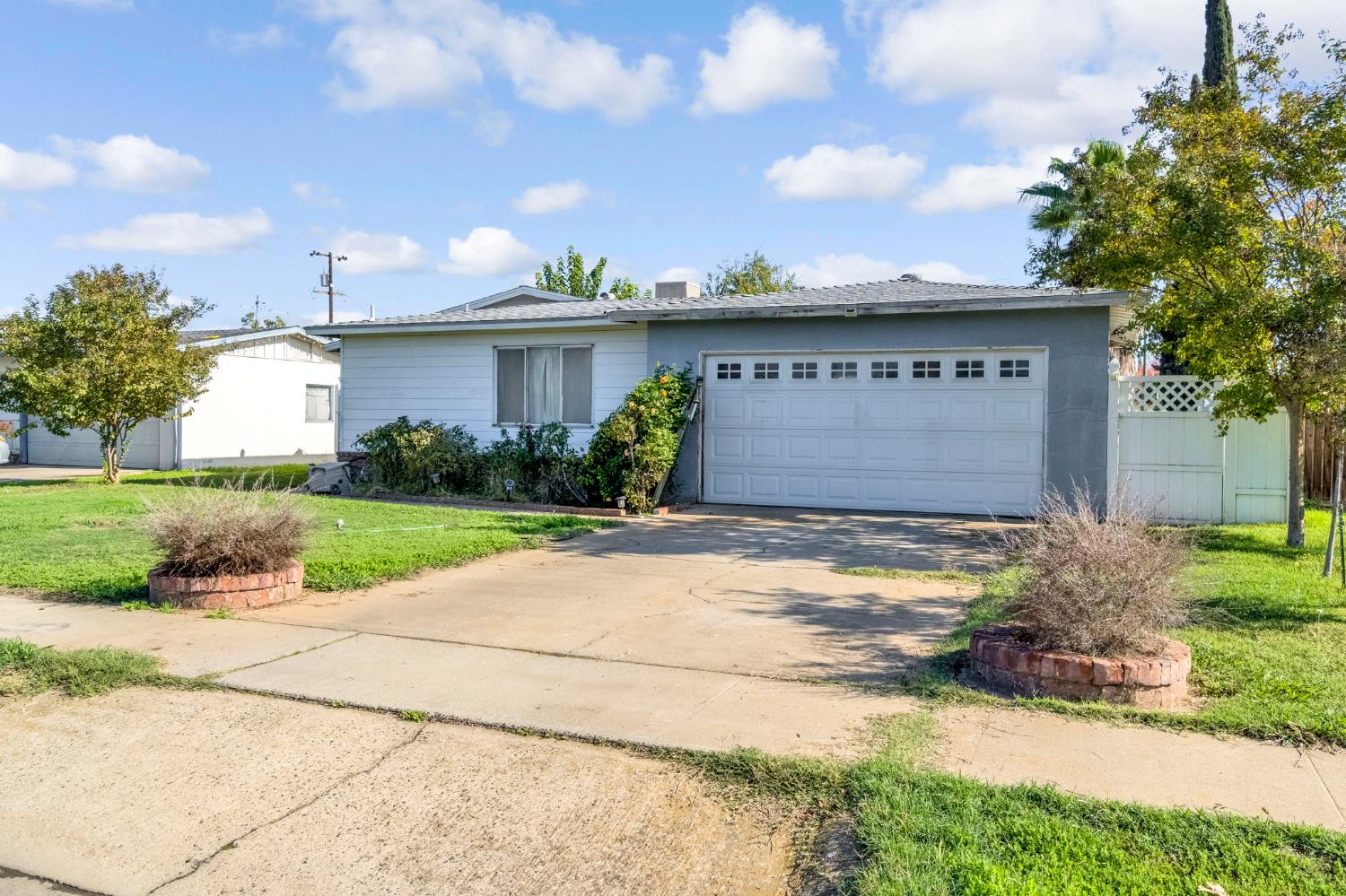 1205 Rogers Street Madera, CA 93638 - Photo 8 of 23 a front view of a house with garden