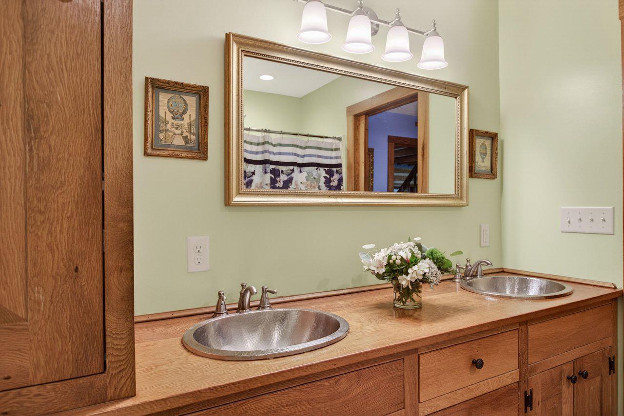 143 Scheffer Gap Road Woodstock, VA 22664 - Photo 21 of 49 Double vanity in primary bathroom on main level.