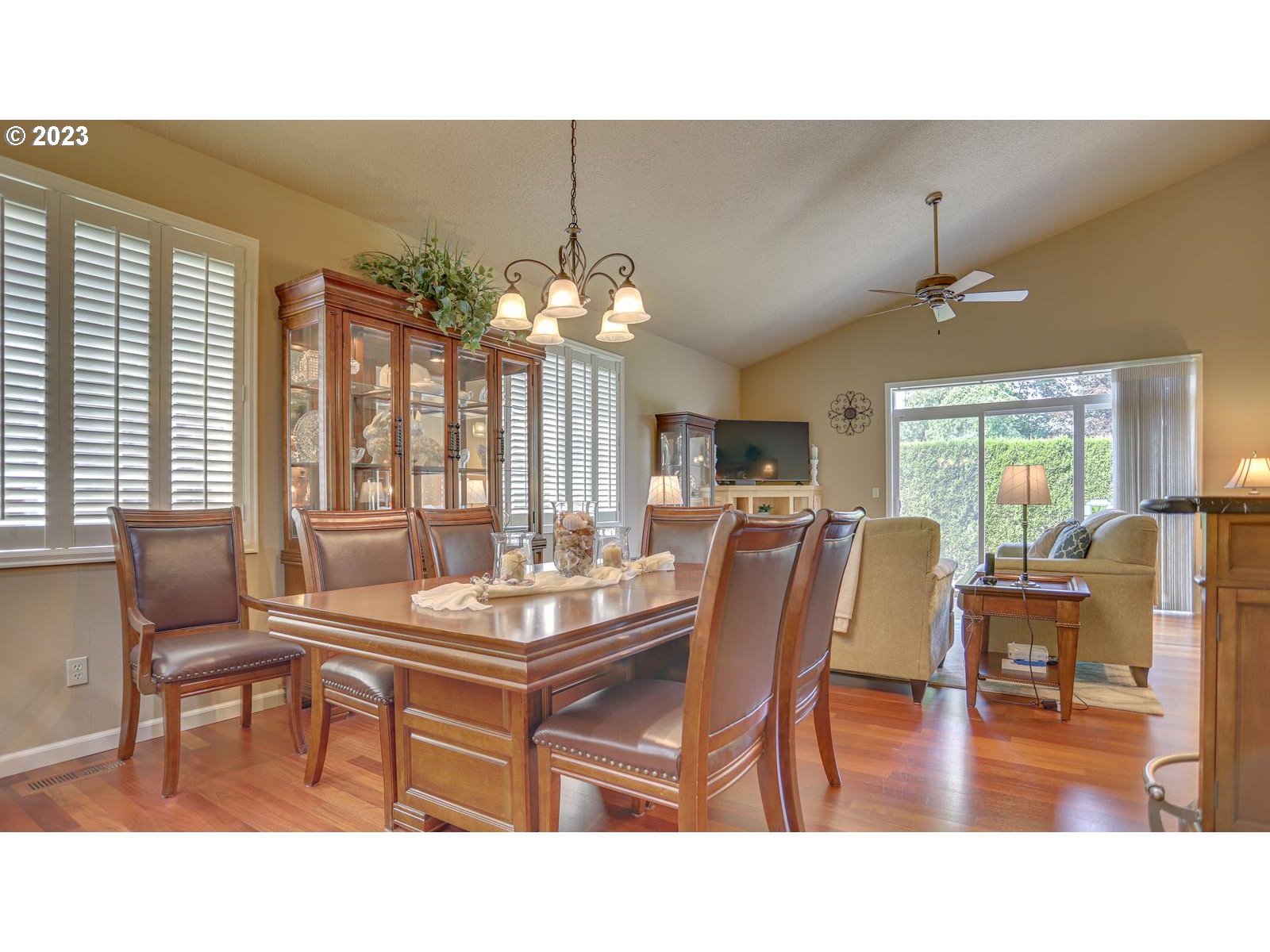 3919 Southeast 31st Street Gresham, OR 97080 - Photo 11 of 26 a dining room with furniture a chandelier and wooden floor