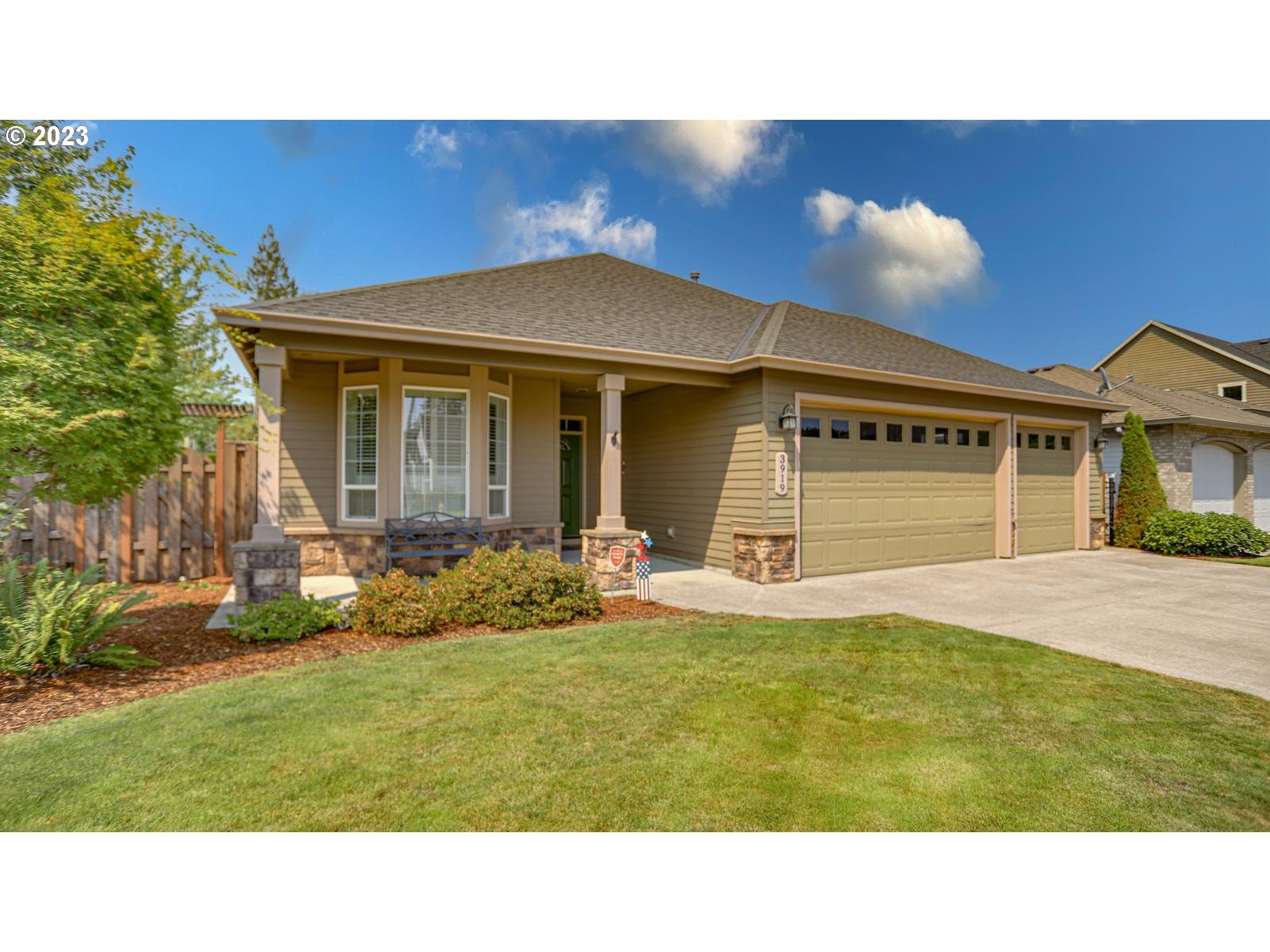3919 Southeast 31st Street Gresham, OR 97080 - Photo 3 of 26 a black white and red house with a yard