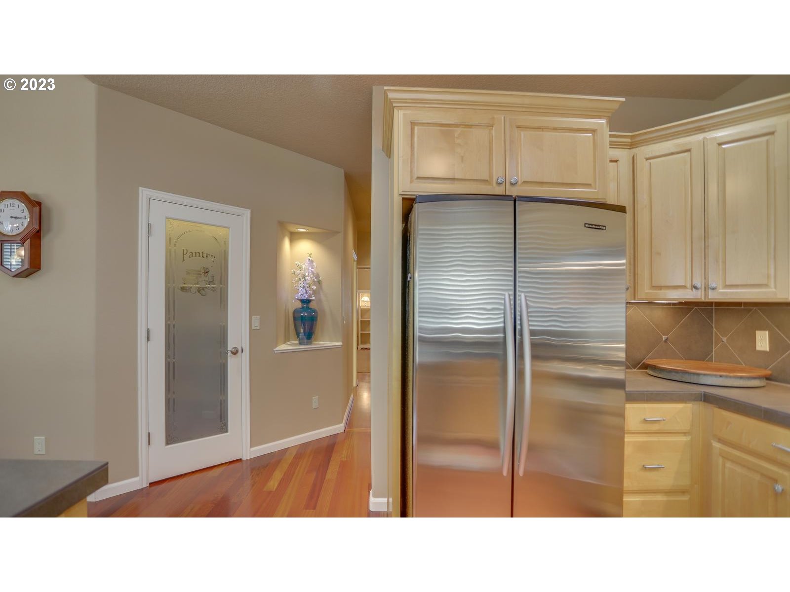 3919 Southeast 31st Street Gresham, OR 97080 - Photo 7 of 26 a kitchen with a refrigerator and cabinets