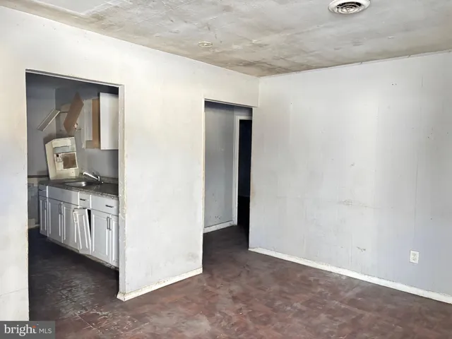 a view of a kitchen from the hallway