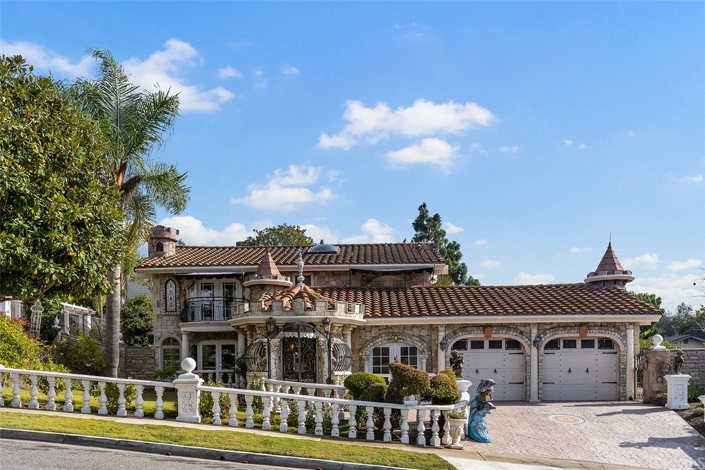 29752 Ivy Glenn Drive Laguna Niguel, CA 92677 - Photo 2 of 36 a front view of a residential apartment building with a yard