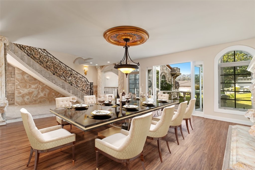 29752 Ivy Glenn Drive Laguna Niguel, CA 92677 - Photo 12 of 36 a dining room with furniture and a chandelier