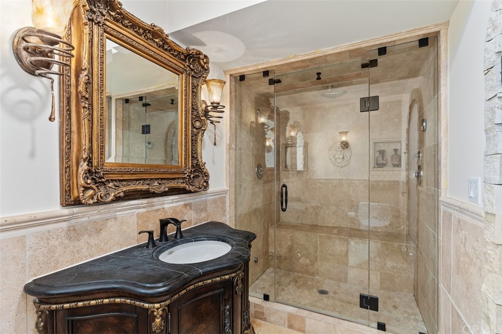 29752 Ivy Glenn Drive Laguna Niguel, CA 92677 - Photo 18 of 36 a bathroom with a sink and a mirror