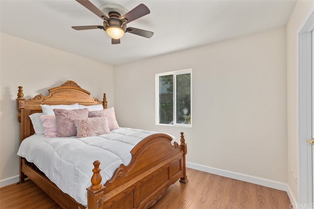 29752 Ivy Glenn Drive Laguna Niguel, CA 92677 - Photo 19 of 36 a bedroom with a bed and a chandelier