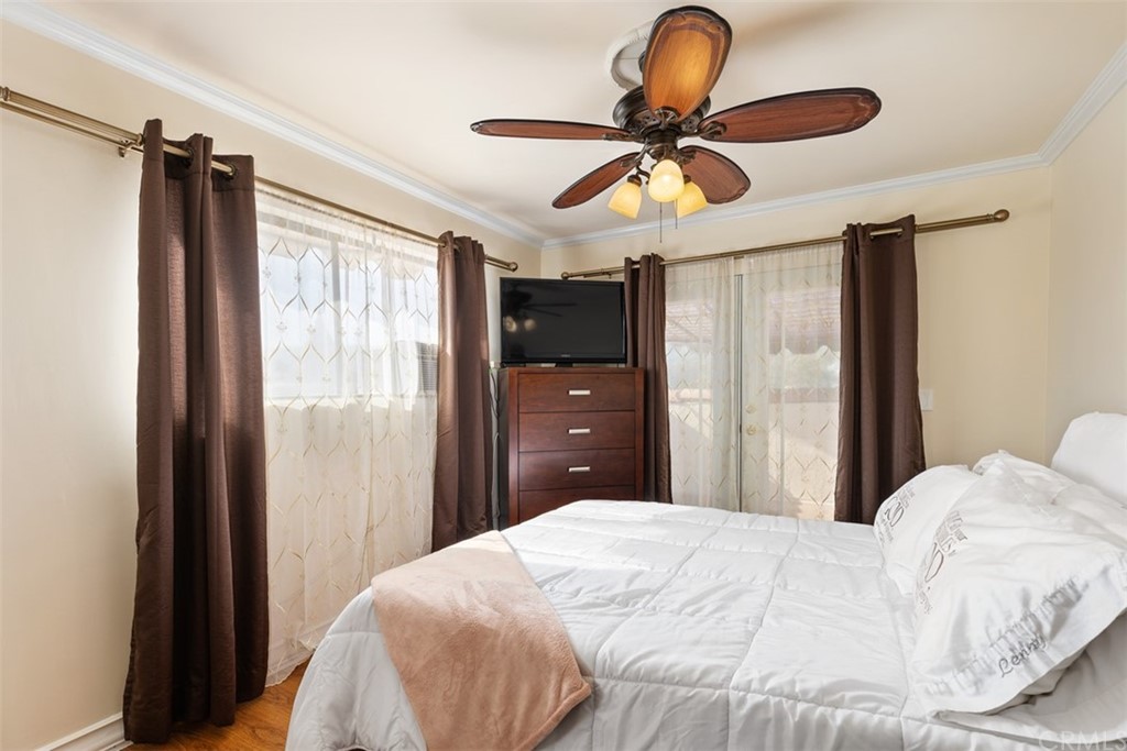 29752 Ivy Glenn Drive Laguna Niguel, CA 92677 - Photo 22 of 36 a bedroom with a bed and a chandelier