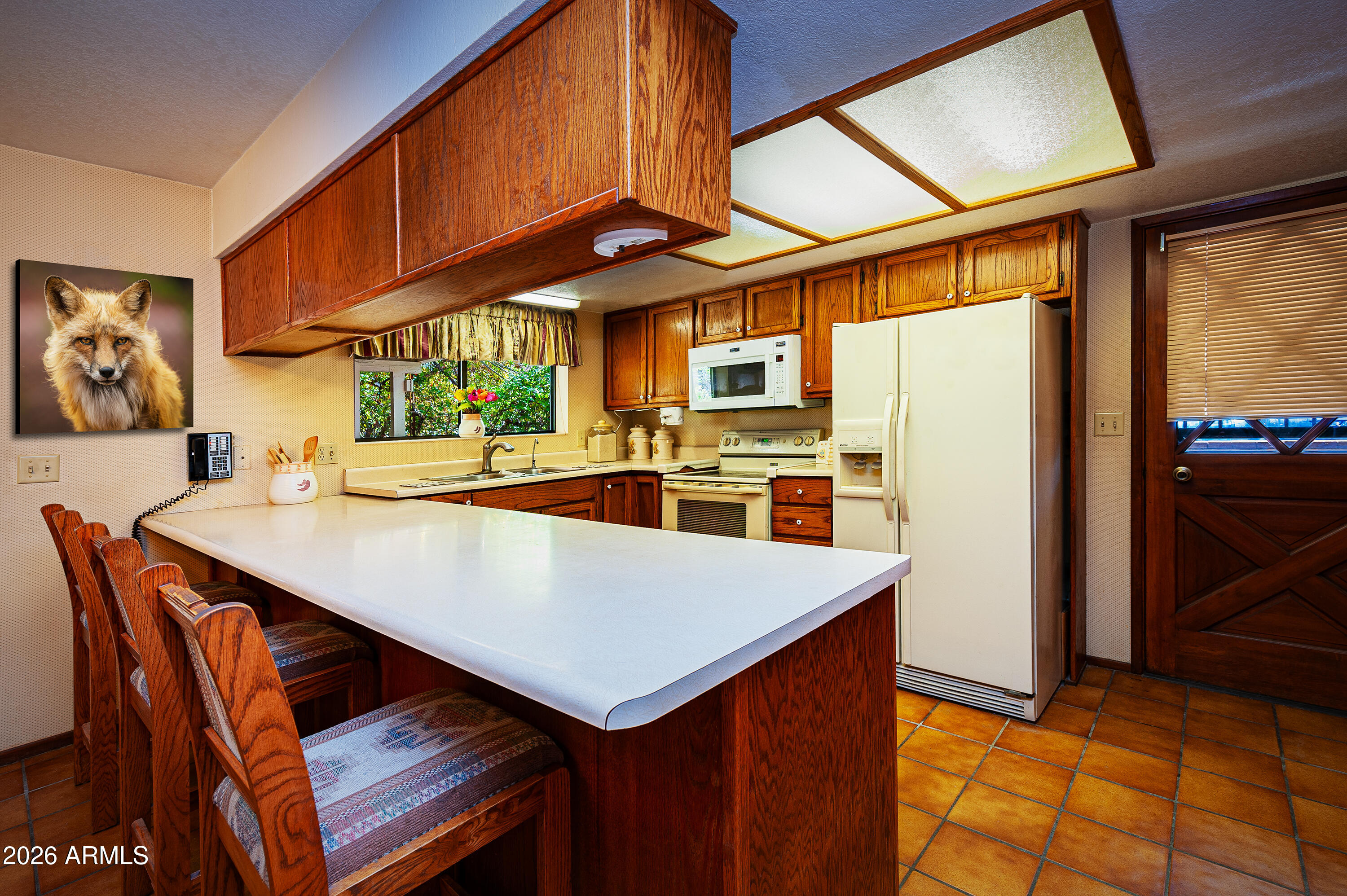 1945 South Loy Road Cornville, AZ 86325 - Photo 4 of 47 a kitchen with stainless steel appliances a stove a refrigerator and a microwave